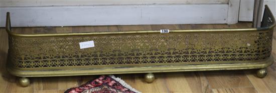A Regency brass kerb